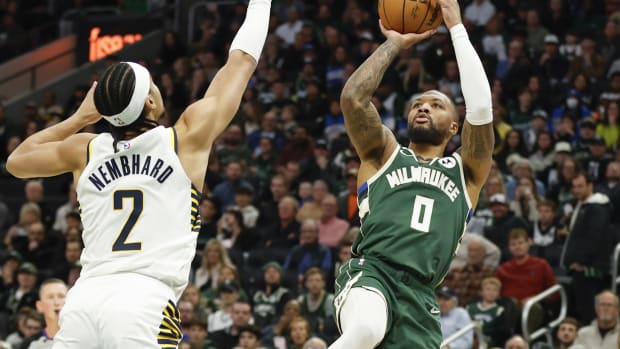 Milwaukee Bucks guard Damian Lillard (0) shoots against Indiana Pacers guard Andrew Nembhard (2)